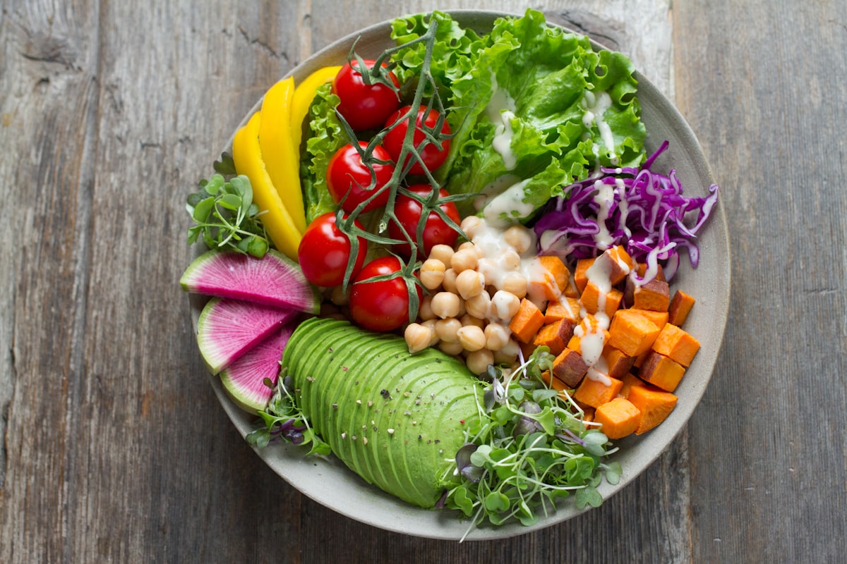 Bowl of colorful vegetable salad representing a balanced diet plate