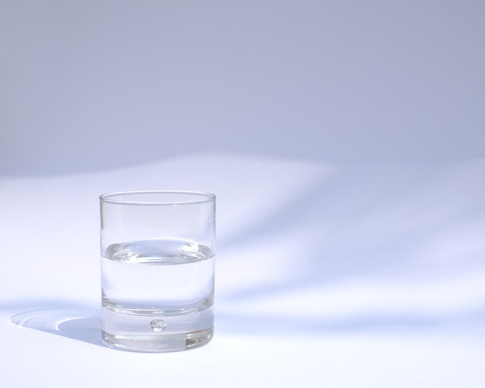 Clear glass filled with water representing daily hydration
