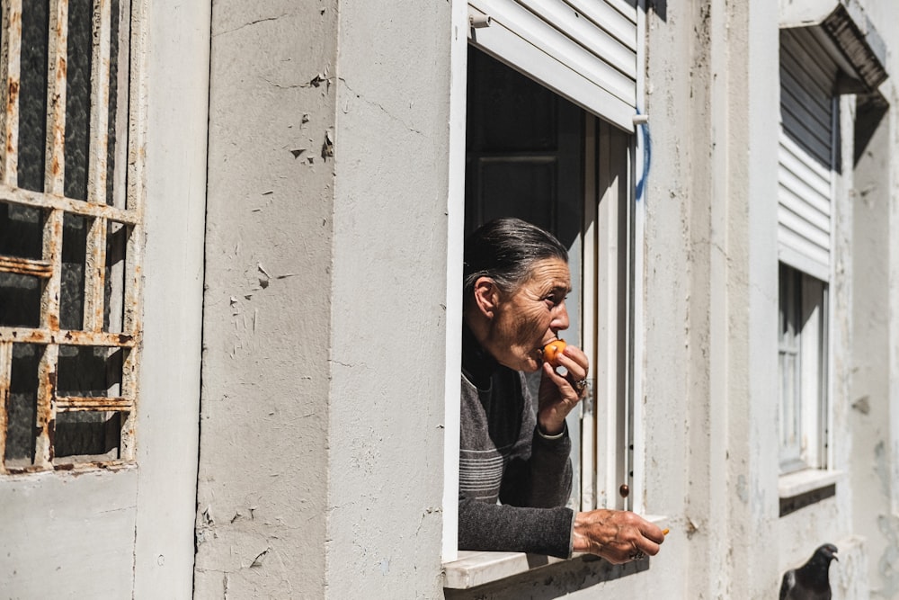 Man eating a meal at the window during his eating window