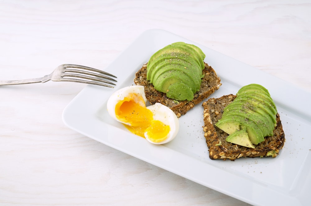 Avocado toast with soft-boiled egg representing balanced carbs, fat, and protein